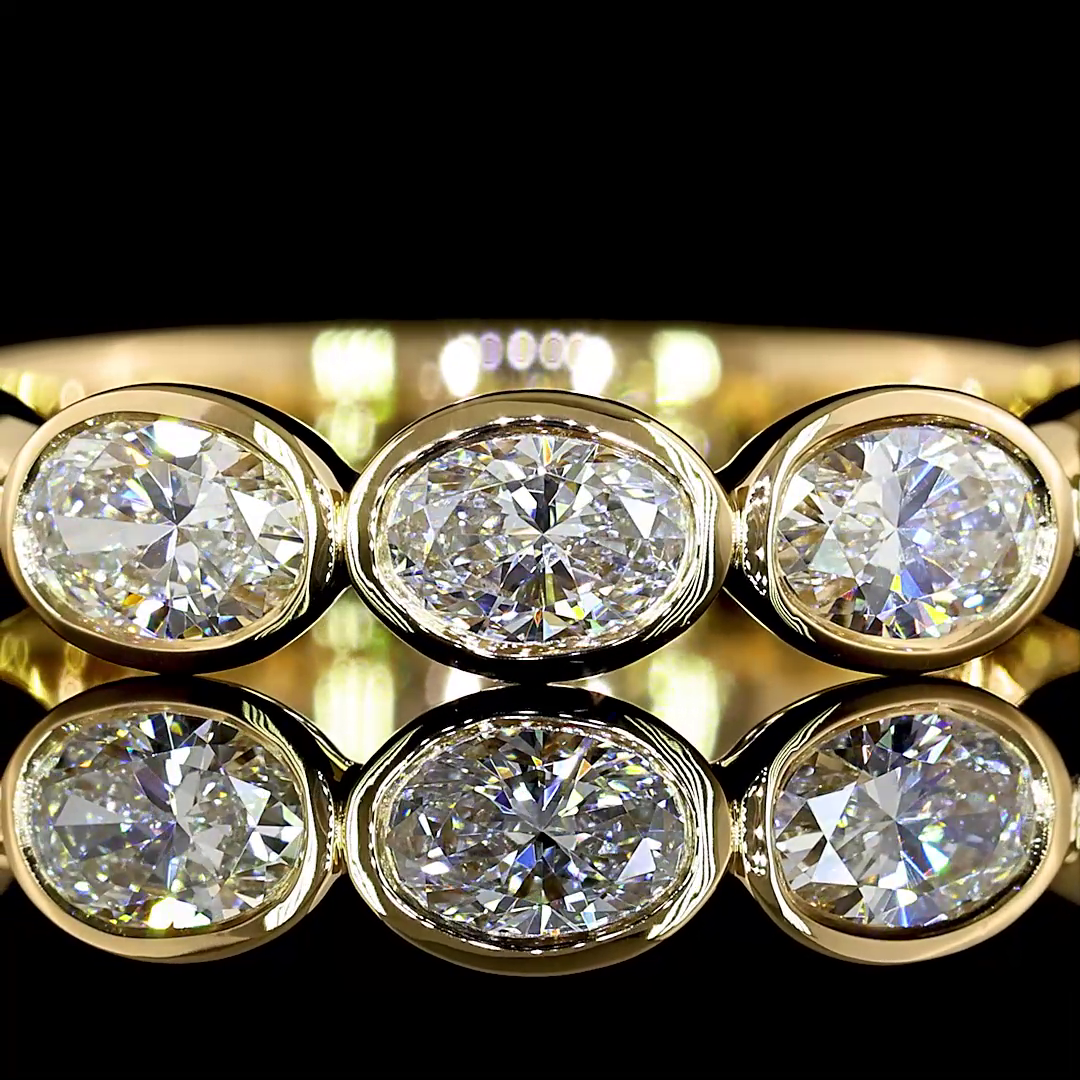 1-1/4ctw Bezel East West Oval 3/4 Eternity Band