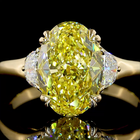 3ct Fancy Yellow Oval Three Stone Engagement Ring.