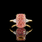 4ct Fancy Pink Cushion Three Stone Engagement Ring.