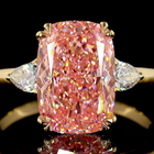 4ct Fancy Pink Cushion Three Stone Engagement Ring.