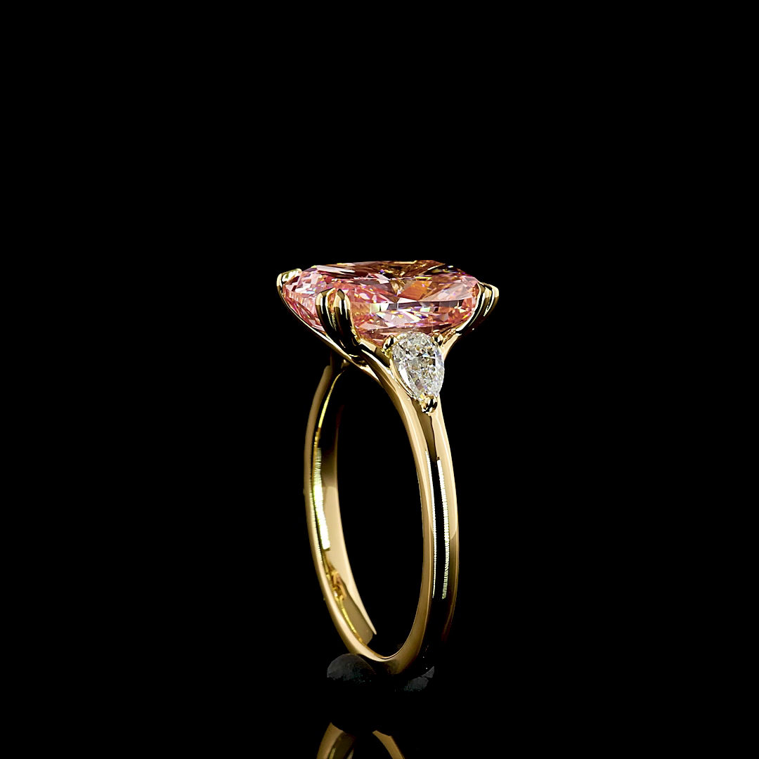 4ct Fancy Pink Cushion Three Stone Engagement Ring.