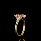 4ct Fancy Pink Cushion Three Stone Engagement Ring.