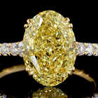 4ct Fancy Yellow Oval Hidden Halo Engagement Ring.